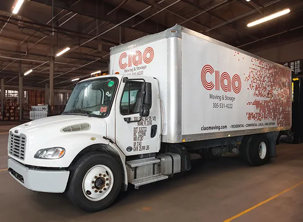 Ciao Moving & Storage truck parked inside a warehouse